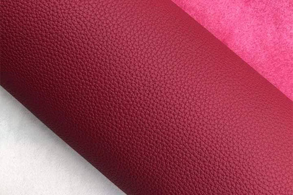 Close-up of Hermès Togo leather — pebbled calfskin with a soft matte finish