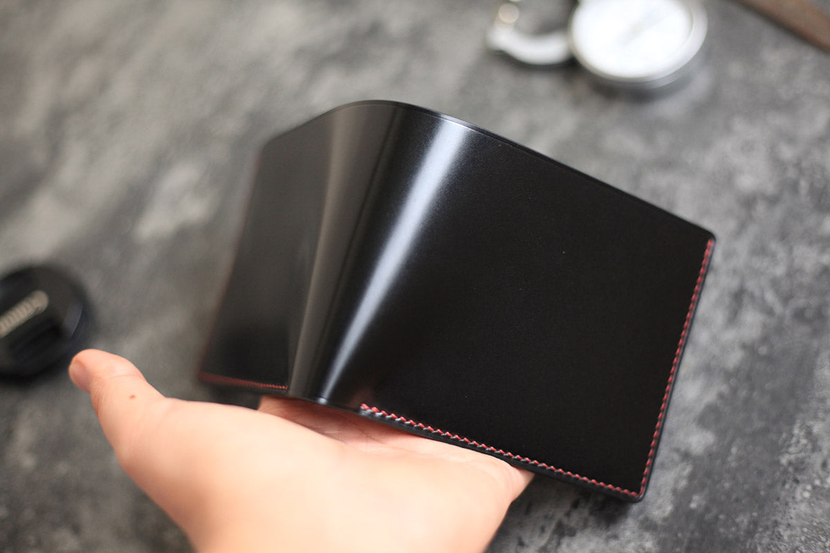 black shell cordovan bifold wallet goat leather