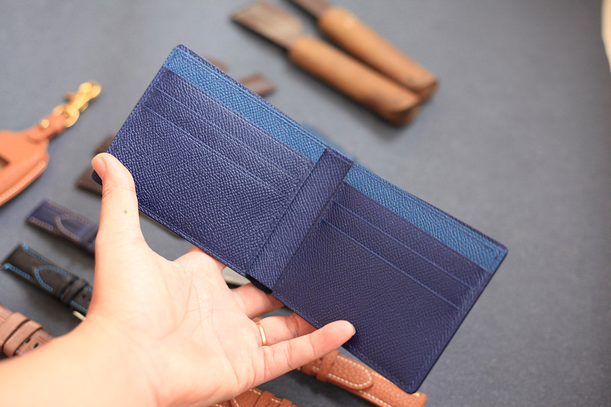 brown and navy blue lizard leather bifold wallet