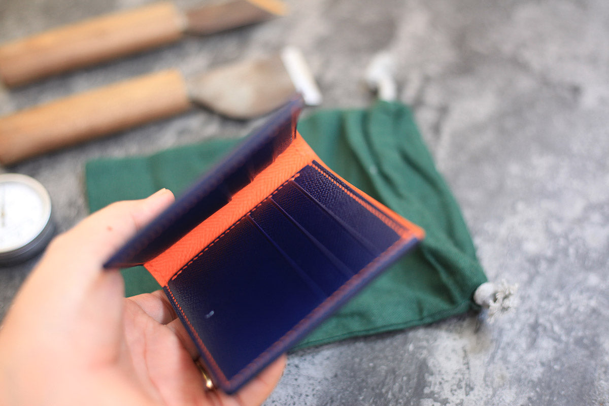 dark blue orange bifold wallet