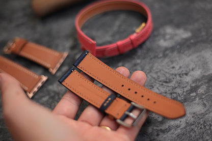 navy blue watch strap with orange stitching